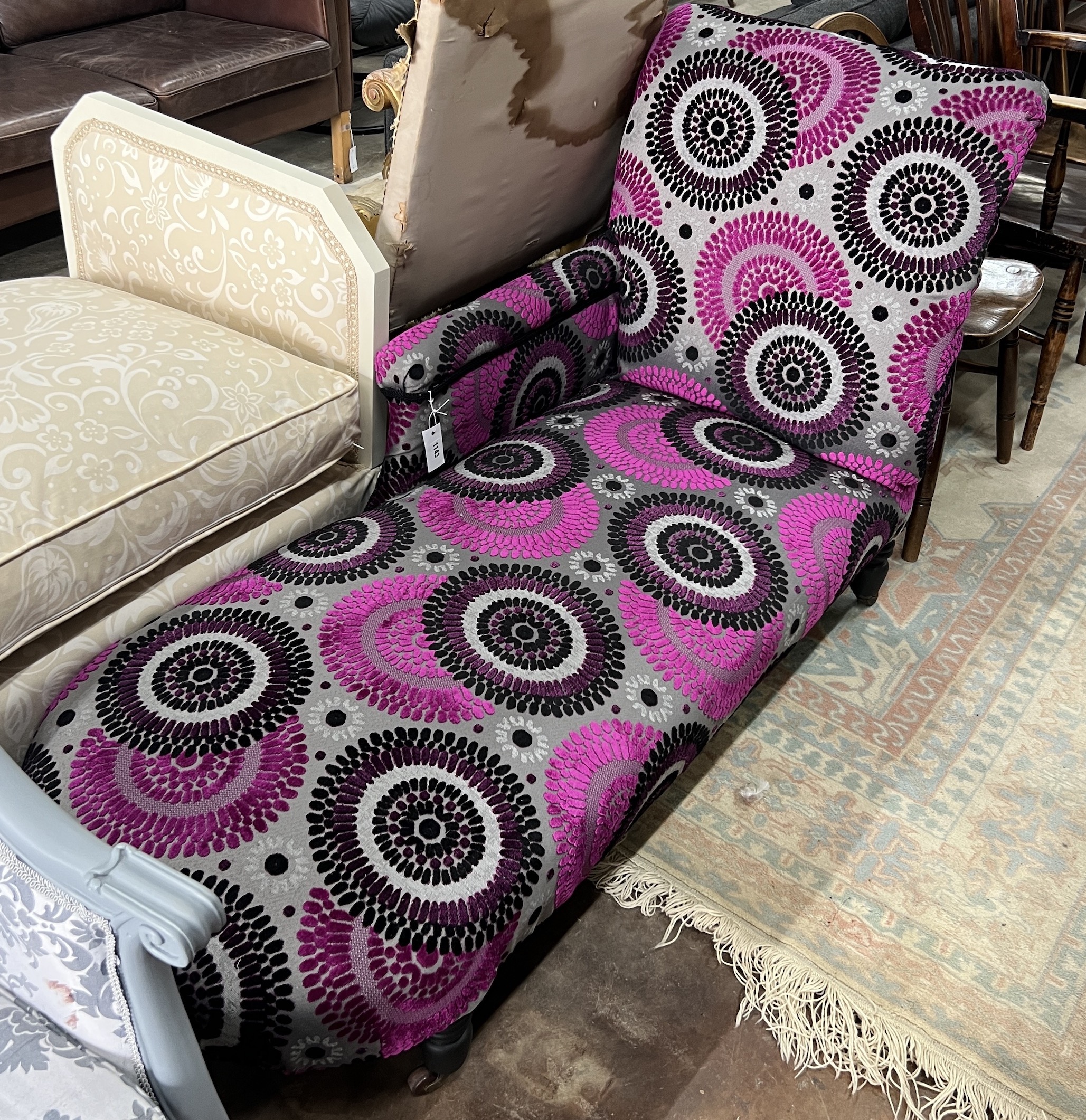 A Victorian style upholstered chaise longue, length 140cm, depth 64cm, height 88cm